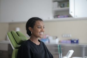 woman smiling and talking with doctor